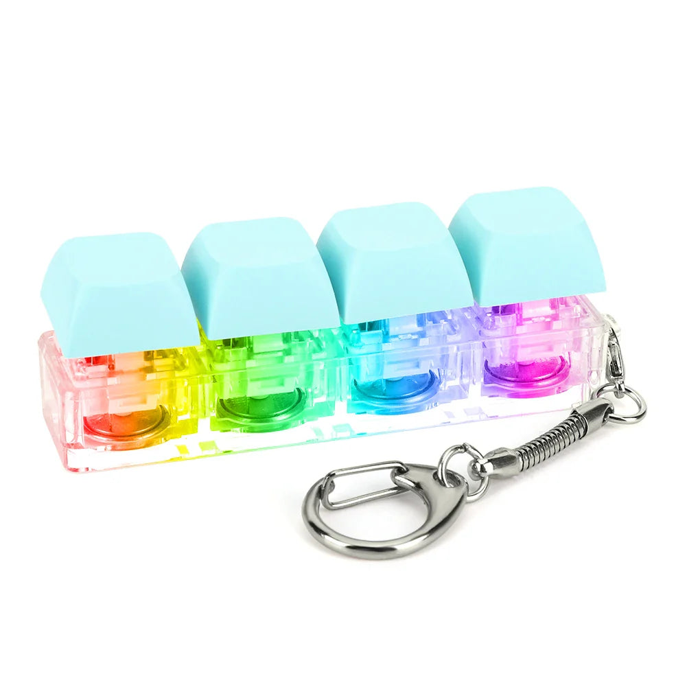 Rainbow-colored translucent keycap fidget keychain with light blue caps and silver metal ring for keyboard clicker toy