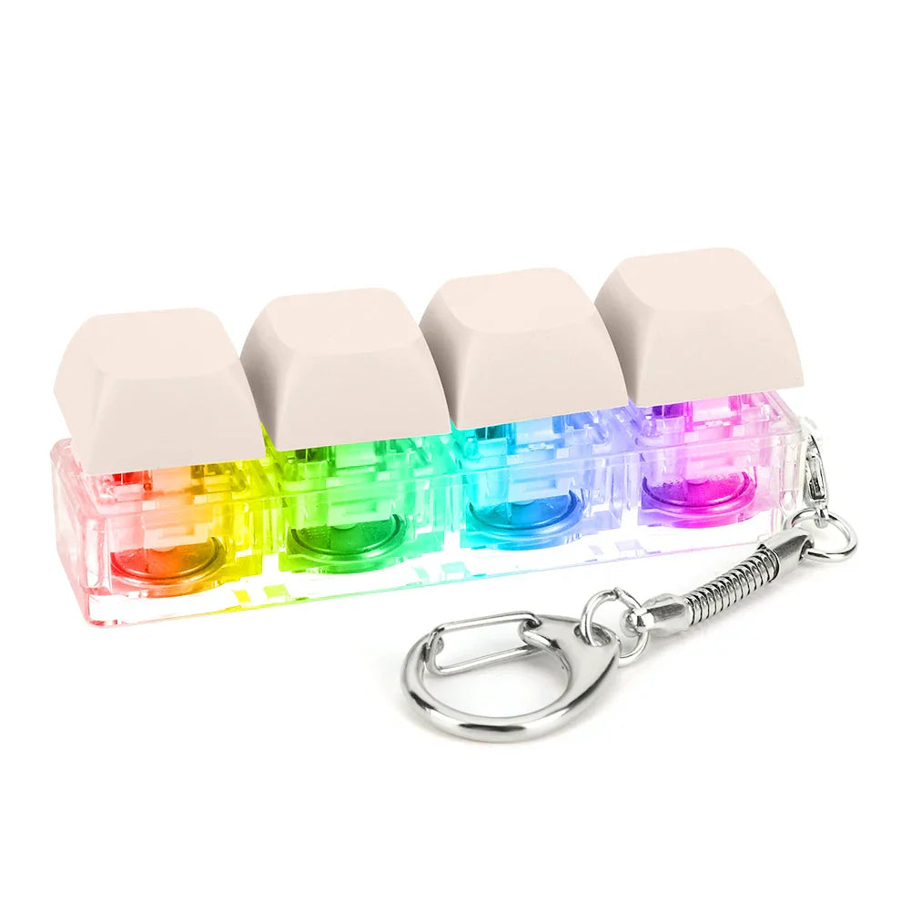 Rainbow-colored translucent keycap fidget keychain with beige top caps and silver ring for keyboard clicker toy use
