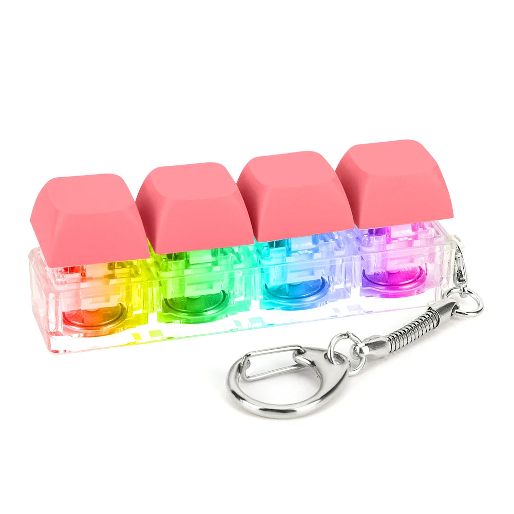Rainbow-colored keycap fidget keychain with pink tops and translucent interior for keyboard clicker toy and stress relief