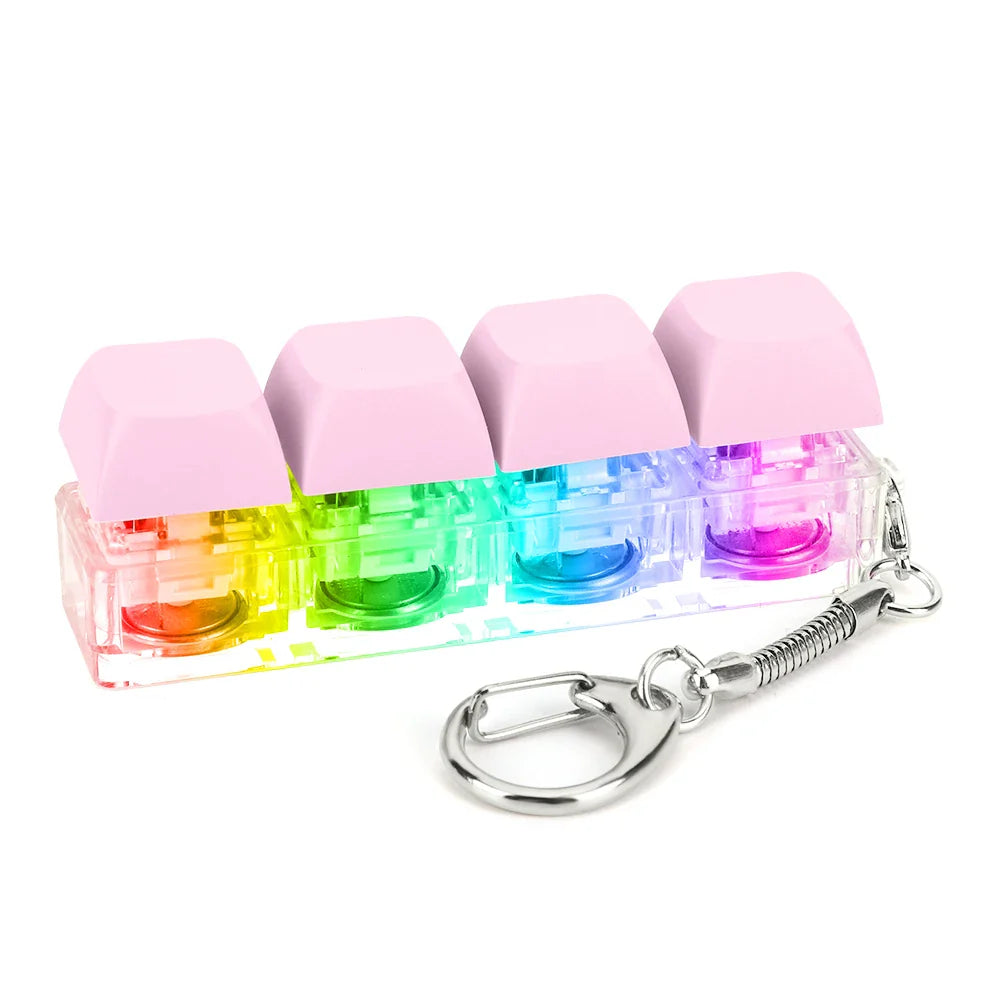 Rainbow-colored keycap fidget keychain with pink tops and translucent liquid compartments on silver ring for relieving stress