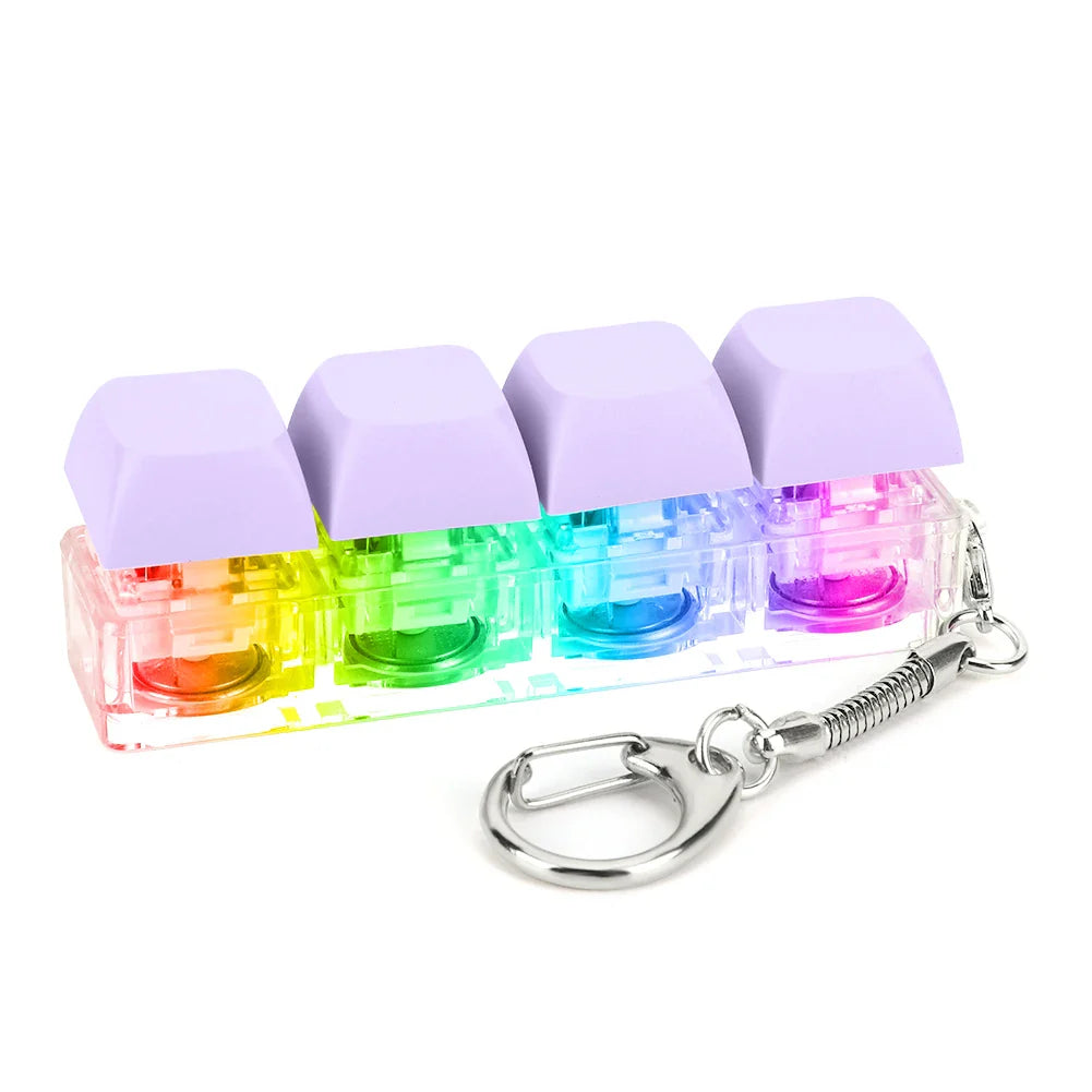 Rainbow-colored translucent keycap fidget keychain with lavender tops and silver clasp for keyboard clicker toy use