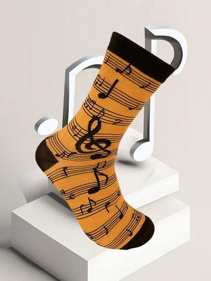 Orange musical note socks with black accents featuring a treble clef design in a fashion music symbol pattern sock combination