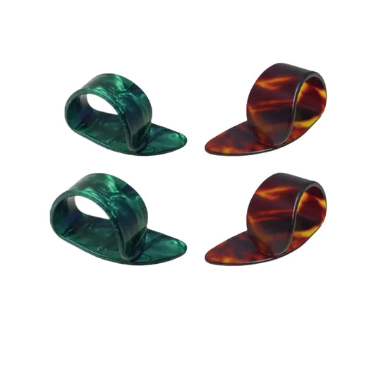 Set of four tortoiseshell and emerald green colored celluloid flat guitar replacement picks with glossy finish and thumb picks