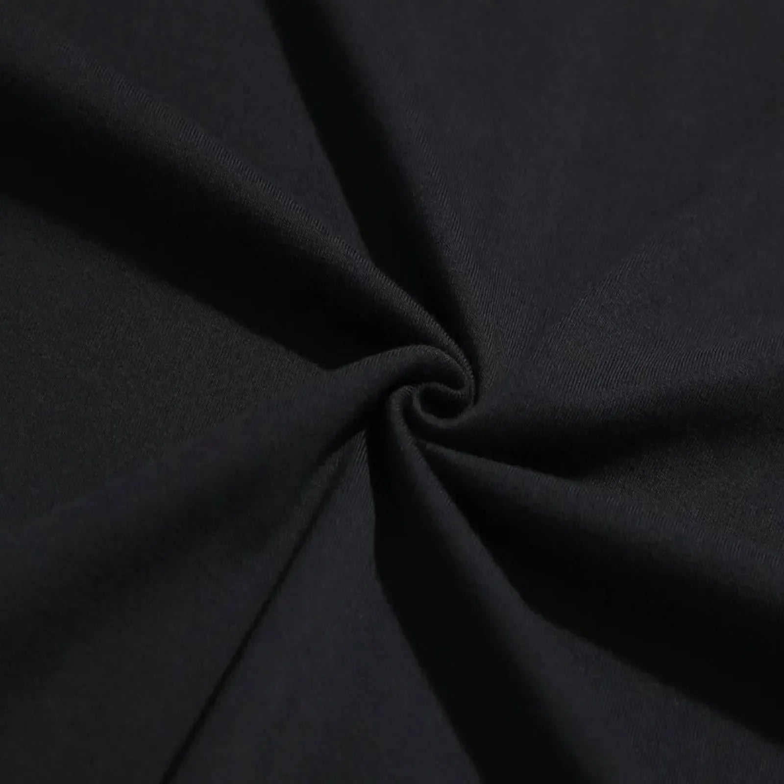 Black soft-textured fabric with subtle sheen and folds from 42nd street broadway small tee 1980s production depression vintage