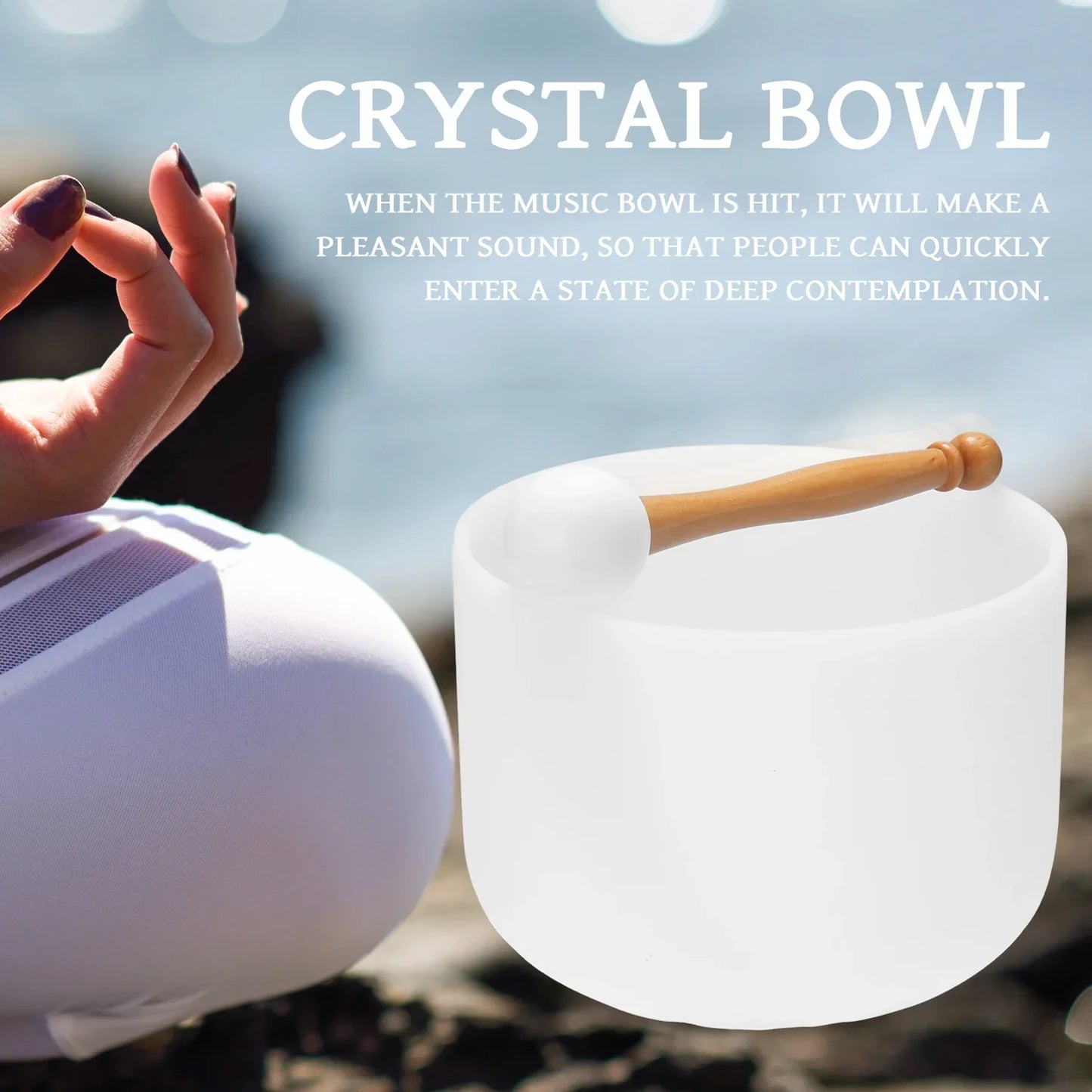 A translucent white 440hz crystal struck bowl with wooden mallet for therapy yoga meditation and ritual music use