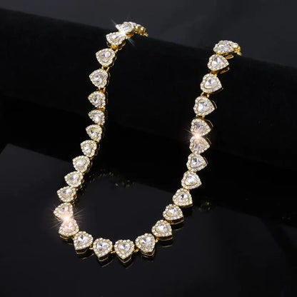 A dazzling gold-tone tennis chain bracelet necklace with shiny heart rhinestone pave crystals for rock party jewelry