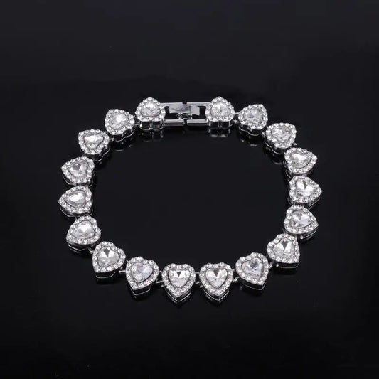 Silver heart-shaped tennis chain bracelet with sparkling clear crystals and sleek clasp for rock party jewelry