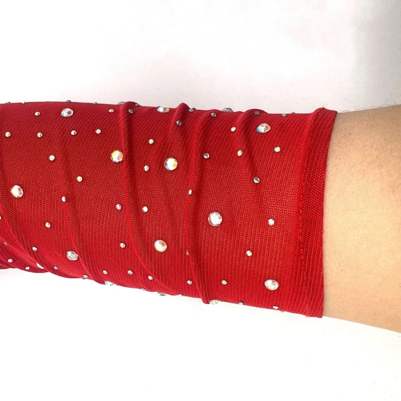 Red stretchy mesh arm cuff with clear silver rhinestones showcasing finger gloves elasticity for electronic music festival cosplay stage performance