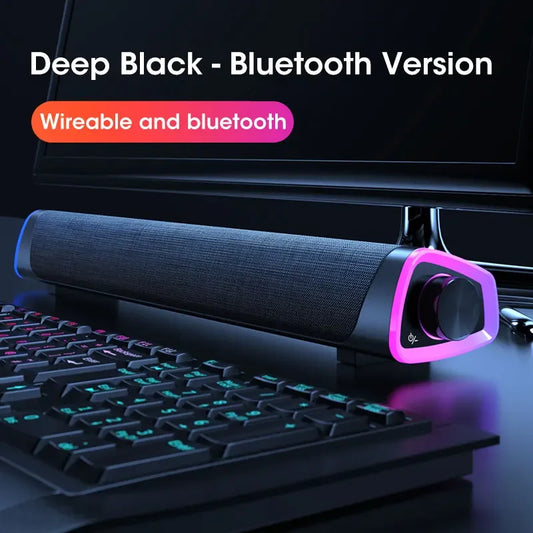 Deep black computer speaker bar with textured fabric grille and glowing purple led accents for notebook pc music