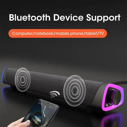 Black fabric-wrapped computer speaker bar with purple led control knob featuring stereo sound subwoofer bluetooth connectivity