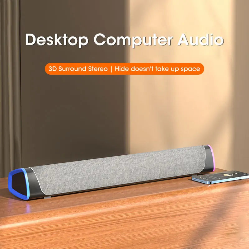 Gray fabric-covered computer speaker bar with blue and black accents featuring stereo sound subwoofer bluetooth for laptops