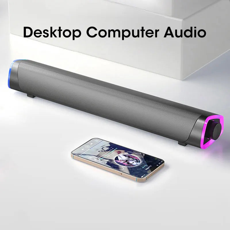 A sleek matte black 4D computer speaker bar with vibrant purple led sound subwoofer bluetooth lighting on its ends