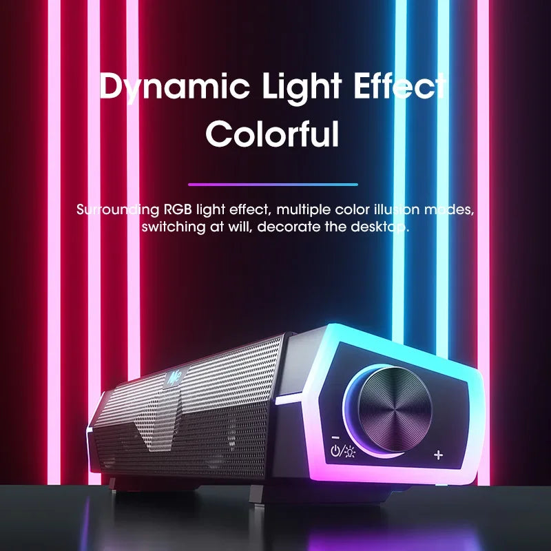 Black and silver gaming projector with circular control dial and rgb lighting featured in wired loudspeaker surround soundbar speaker stereo subwoofer setup