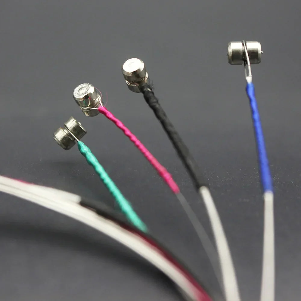 Silver-colored magnetic sensor probes with pink black blue and green insulated wires for violin strings steel core nickel use