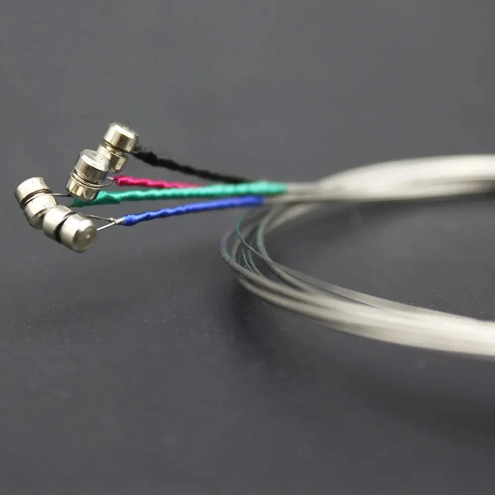 Set of four violin strings E A D G with steel core nickel and nickel silver wound in black pink teal and blue colors