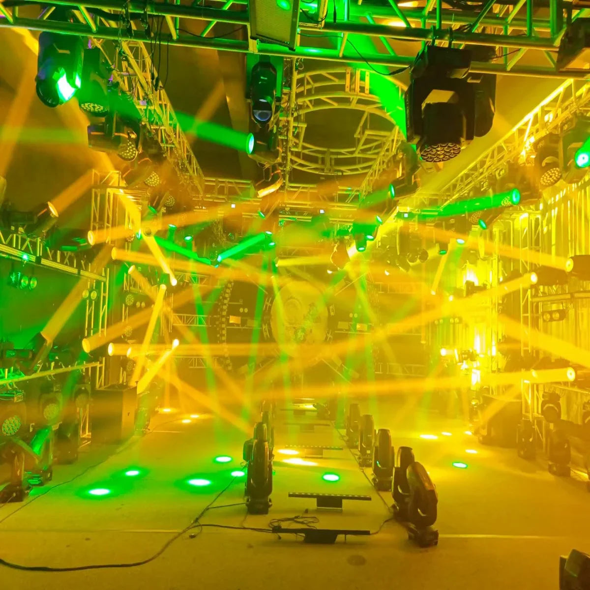 A stage lighting rig with 4pcs mini led moving head 150w lights featuring green and yellow beams and rotating prisms dmx effects