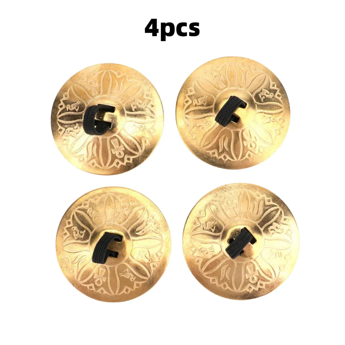 Four ornate gold copper finger cymbals with embossed floral design and black fasteners for belly dance hand cymbals