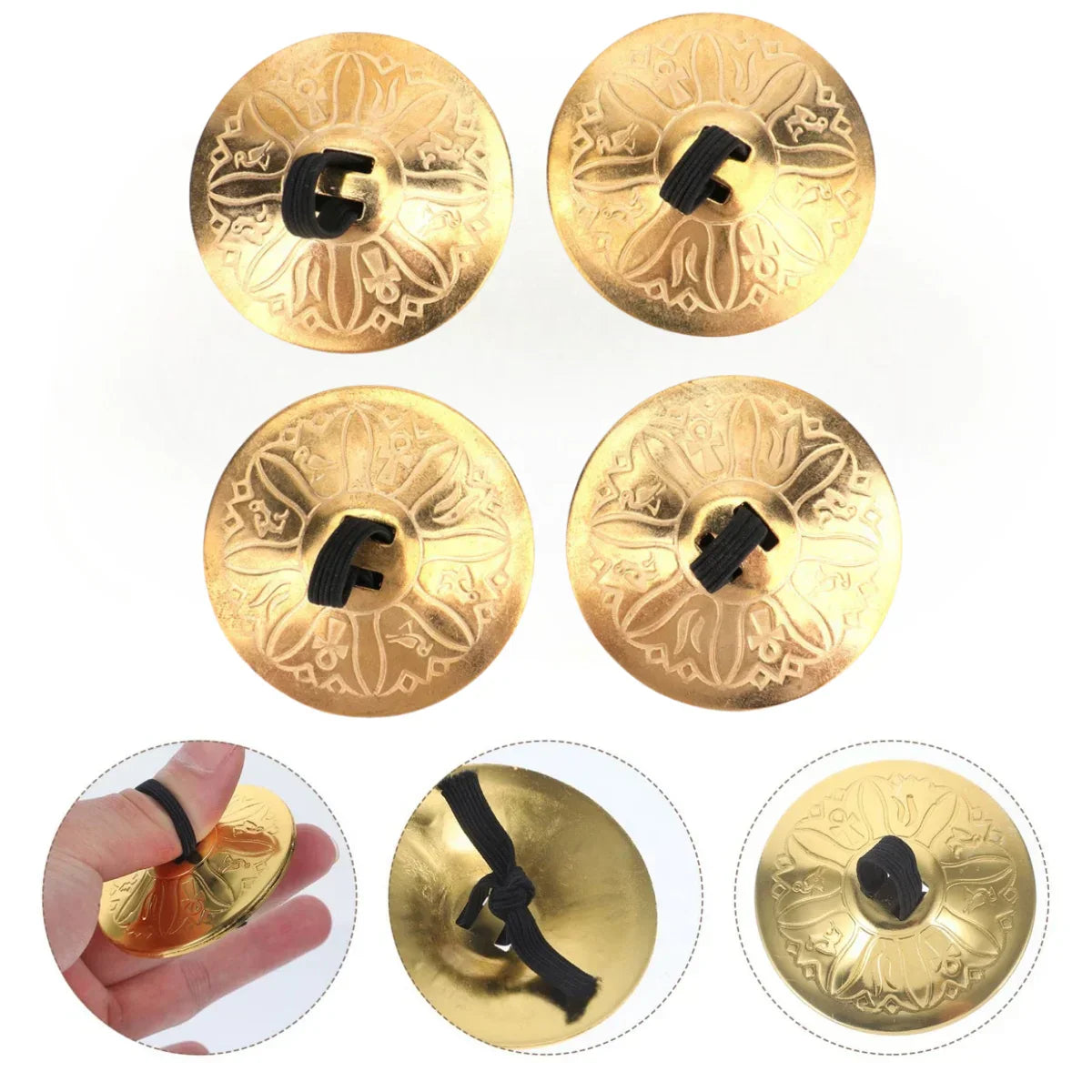 Golden copper finger cymbals with intricate floral engravings and black rubberized handles for finger cymbals belly dance