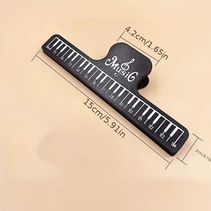 Black piano key design 4pcs music book clips with white numbered keys branded music, ideal for sheet music stands