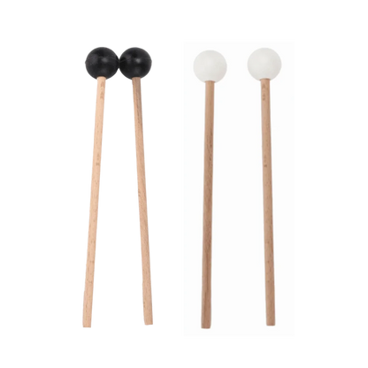 A pair of wood handle wooden drumsticks with black and white silicone rubber heads for steel tongue drums