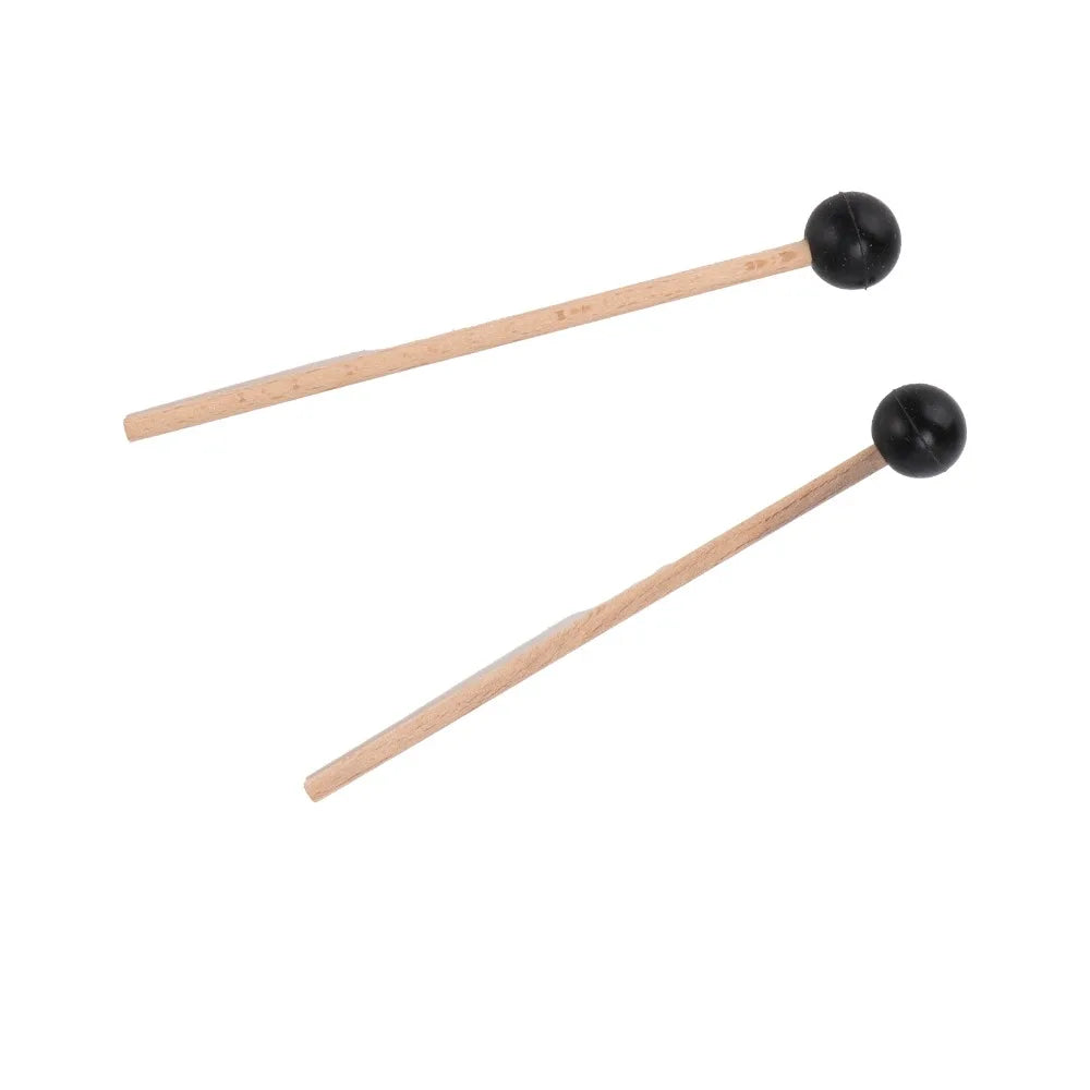 A pair of wooden drumsticks with wood handle and black spherical rubber heads for steel tongue drum playing