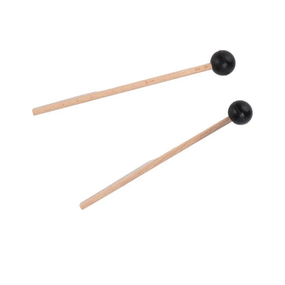 A pair of wooden drumsticks with wood handle and black spherical rubber heads for steel tongue drum playing