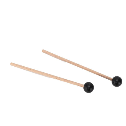 A pair of wooden drumsticks with wood handle and black rubber spherical heads for steel tongue drum use