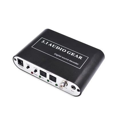 Black 5.1 digital audio decoder back panel with silver accents featuring aux coaxial and dolby pro logic labeled ports