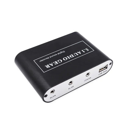 Black rectangular 5.1 digital audio decoder with silver accents showing rear aux coaxial usb speaker and subwoofer ports for dolby pro logic