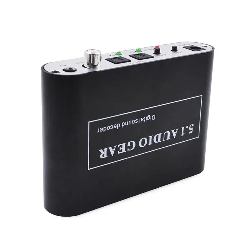 Black rectangular digital audio decoder with silver trim and control buttons for dolby pro logic aux coaxial connectivity