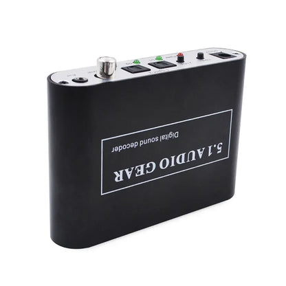 Black rectangular digital audio decoder with silver trim and control buttons for dolby pro logic aux coaxial connectivity