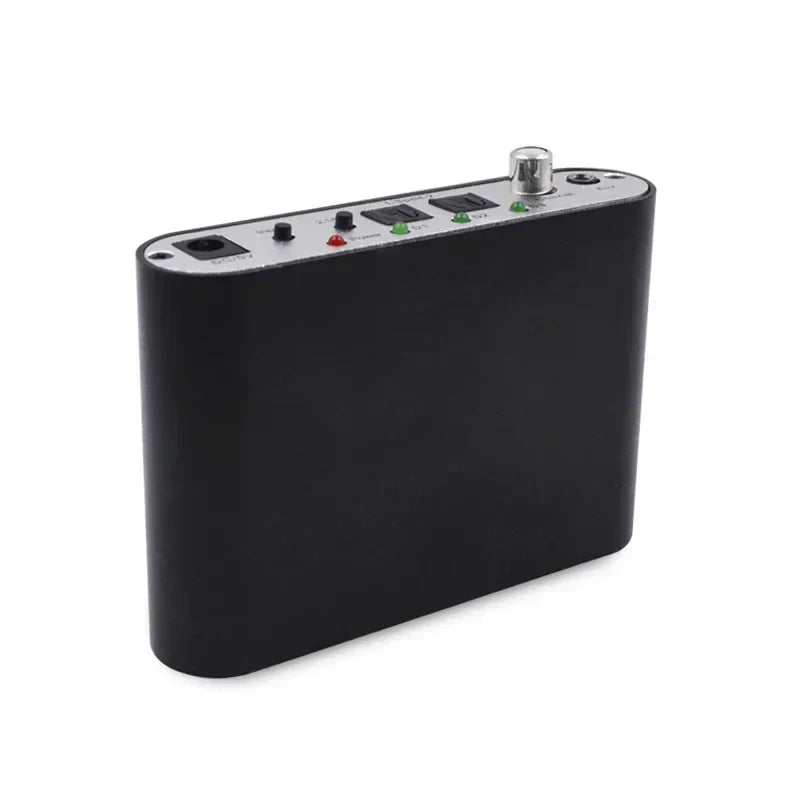 Black rectangular 5.1 audio decoder with silver control panel featuring dts ac3 pcm aux coaxial input output ports and lights
