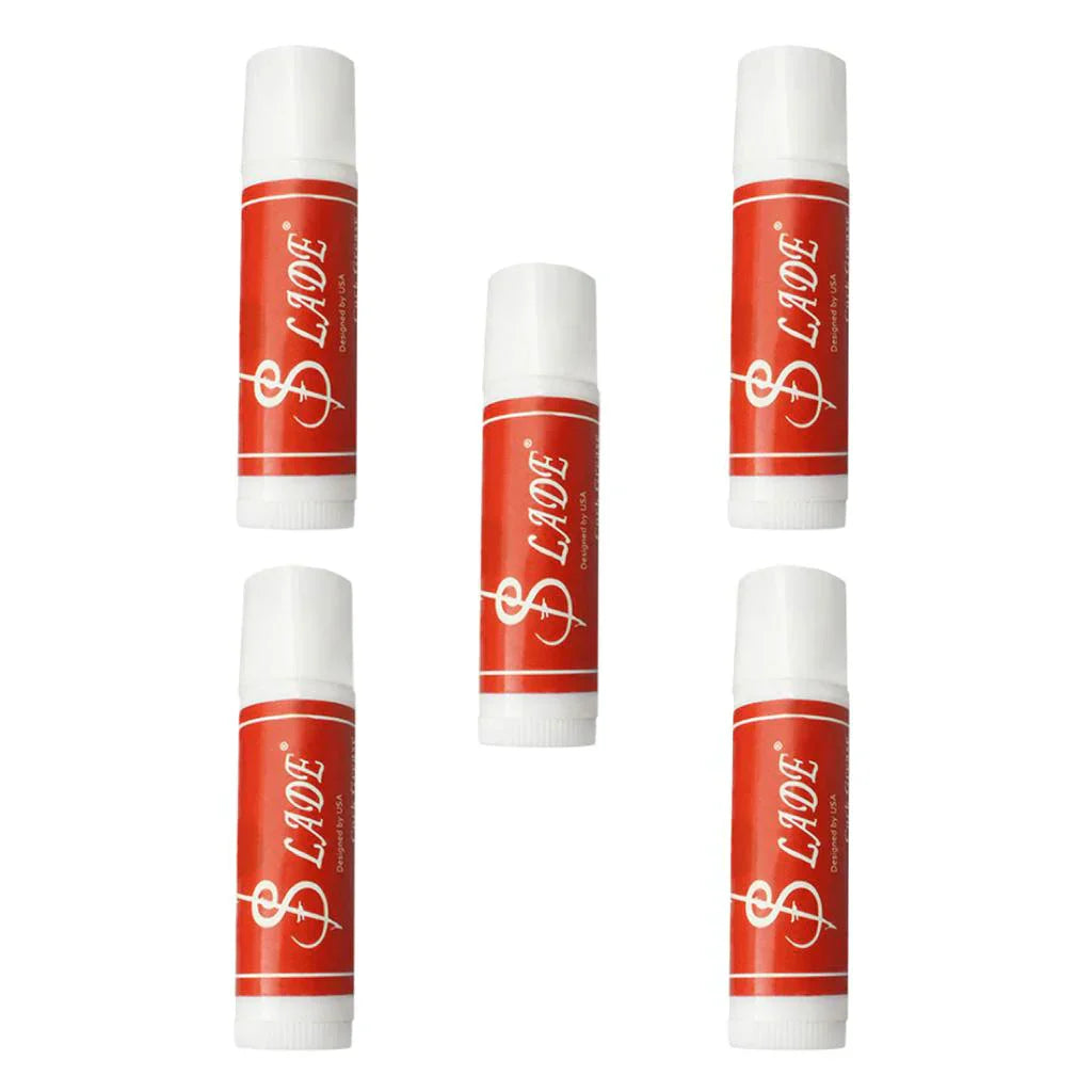 Five red and white tubes cork grease lip balm with stylized dollar sign logo for musical woodwind instruments clarinet saxophone