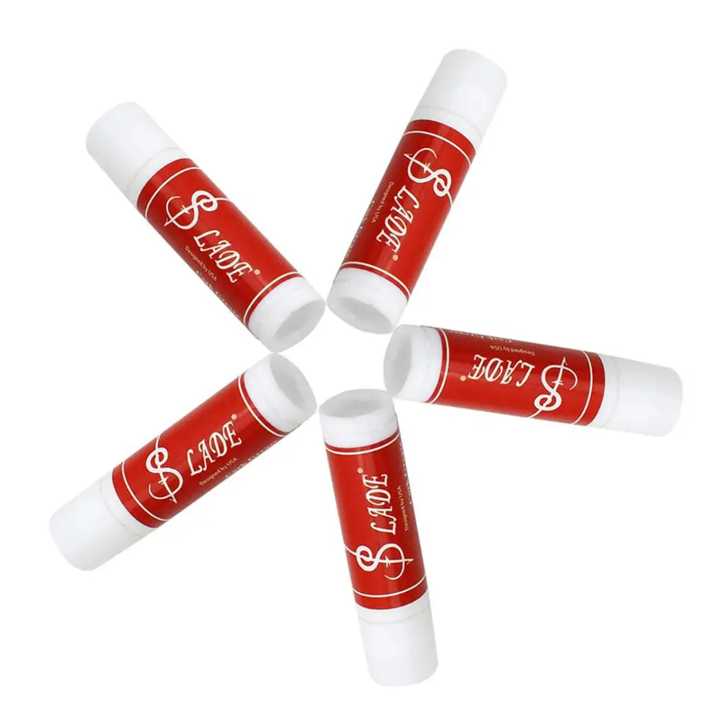 Red and white branded tubes cork grease with dollar sign logo for high quality instruments clarinet saxophone lubricant