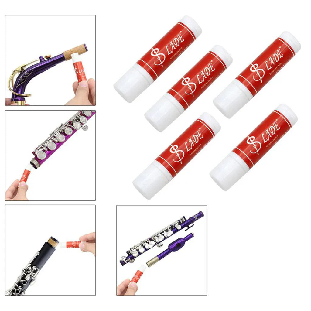 Red and white cylindrical tube of blade brand cork grease for musical woodwind instruments clarinet saxophone lubricant