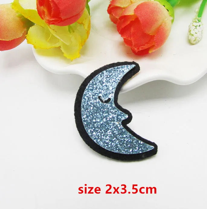 A charming blue glittery crescent moon sparkle patch padded with black embroidery for applique decoration diy