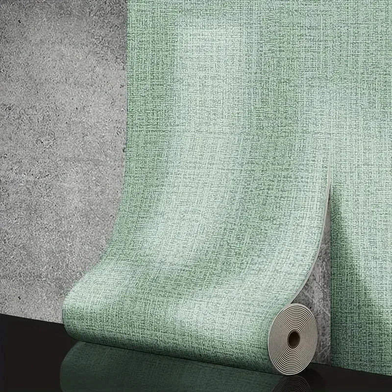 A roll of self-adhesive foam wall panel in textured mint green with a 3d linen pvc pattern for living room decor