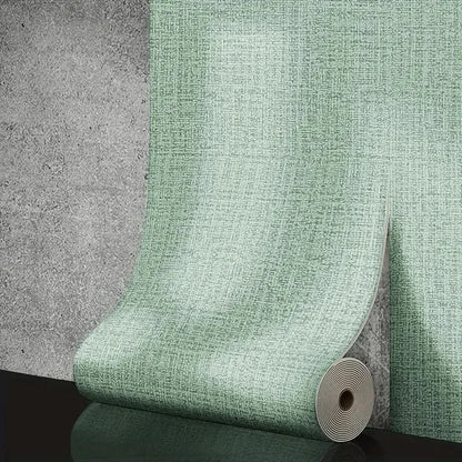 A roll of self-adhesive foam wall panel in textured mint green with a 3d linen pvc pattern for living room decor