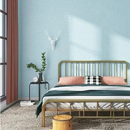 Gold metal bed frame with vertical slats and matching headboard next to 50cm self-adhesive foam wall panel for living room decor
