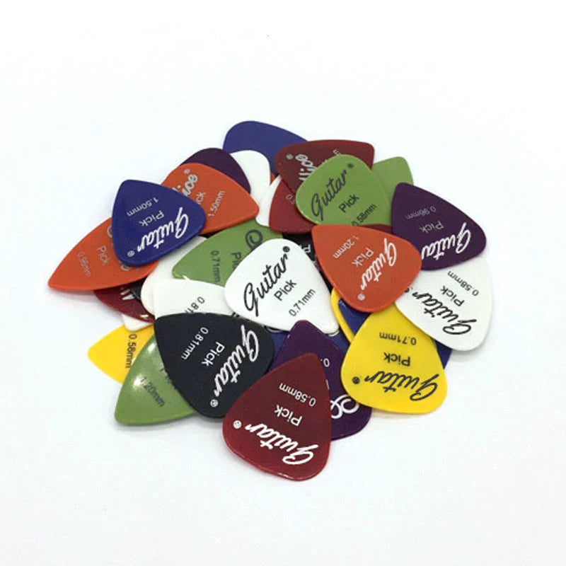 A colorful assortment of electric guitar pick and guitar pick acoustic with 50mm thickness in various hues and thicknesses