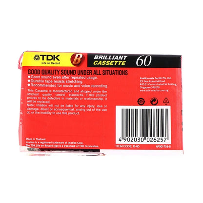 Red and black tdk brilliant cassette 60 packaging with yellow accents for high qulity standard magnetic audio tape recording