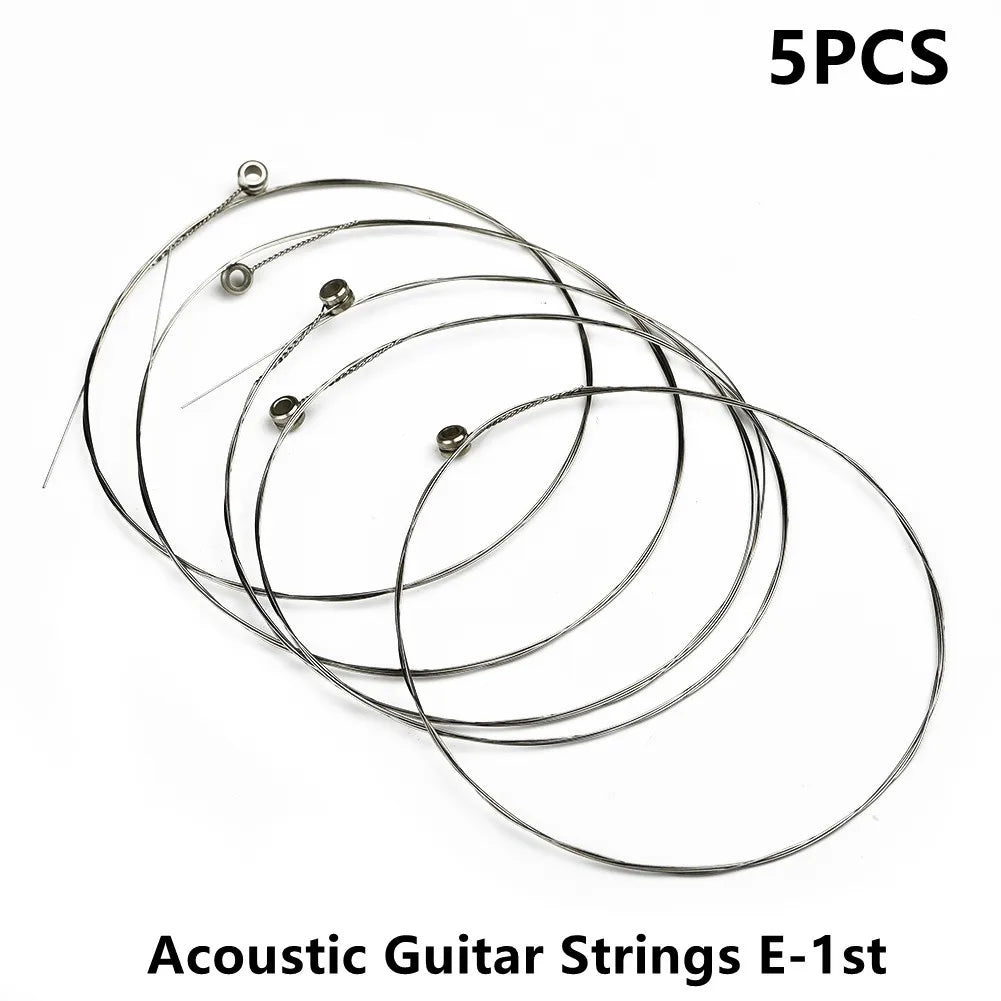 Five metallic single guitar strings acoustic with circular metal anchors for replacement musical instrument use