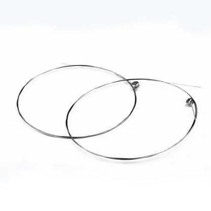 Two black circular metal wire hoops with small spherical ends for single guitar strings acoustic replacement musical instrument