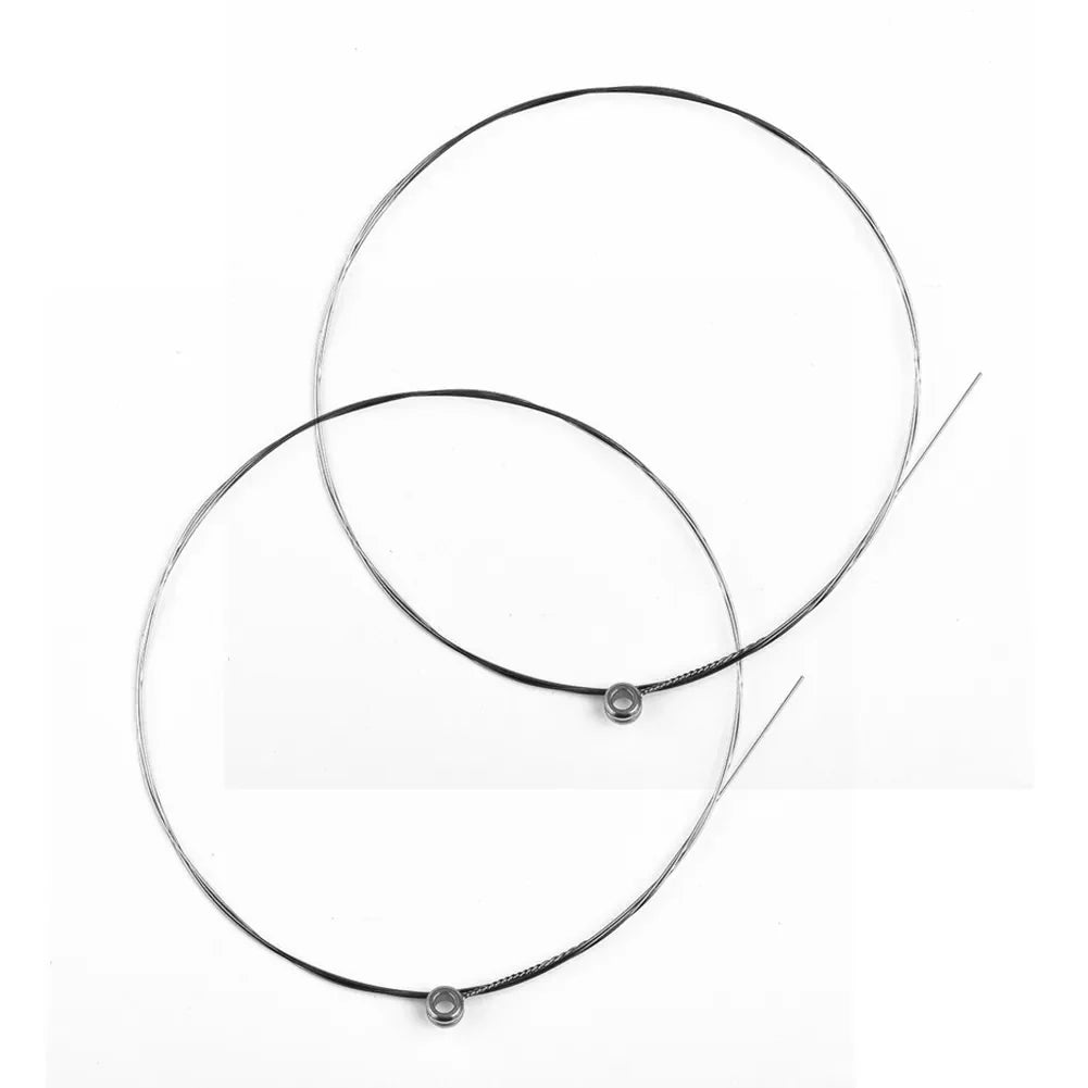 Two black and silver single guitar strings acoustic with metallic ball ends for replacement musical instrument use