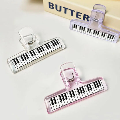 Clear and pink translucent acrylic sheet music clip with piano pattern strong grip for music stand and test paper organizer