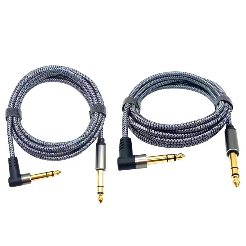 Two coiled gray braided 6.35mm guitar cables with gold-plated jacks for professional wire amp and electric guitar use