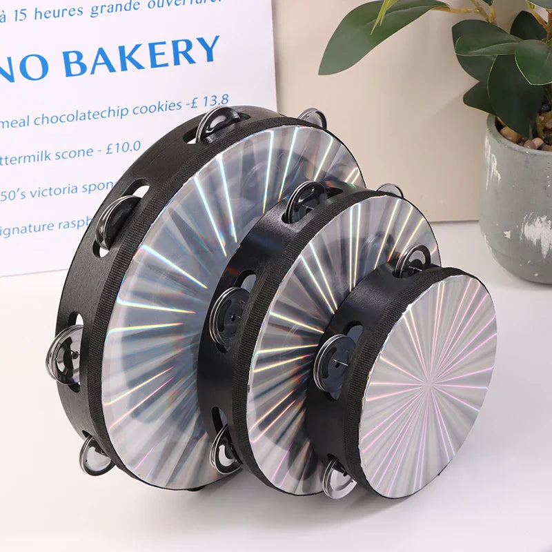 Set of three silver-finished wooden radiant tambourine handbells with black rims and double row jingles for musical education