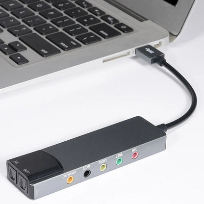 Black and silver aluminium 6-in-1 usb external optical sound card with color-coded input output ports for stereo sound