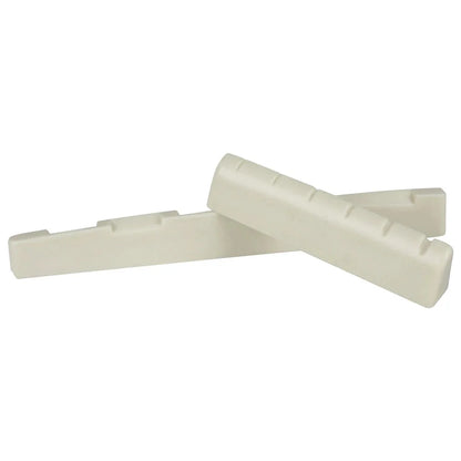 Two off-white rectangular guitar bridge saddles with molded string slots for 6 string acoustic instrument replacement parts