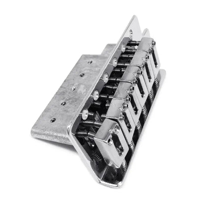 Chrome finished six-string guitar bridge saddle with polished metal saddles and visible springs for tremolo bridge set musical use